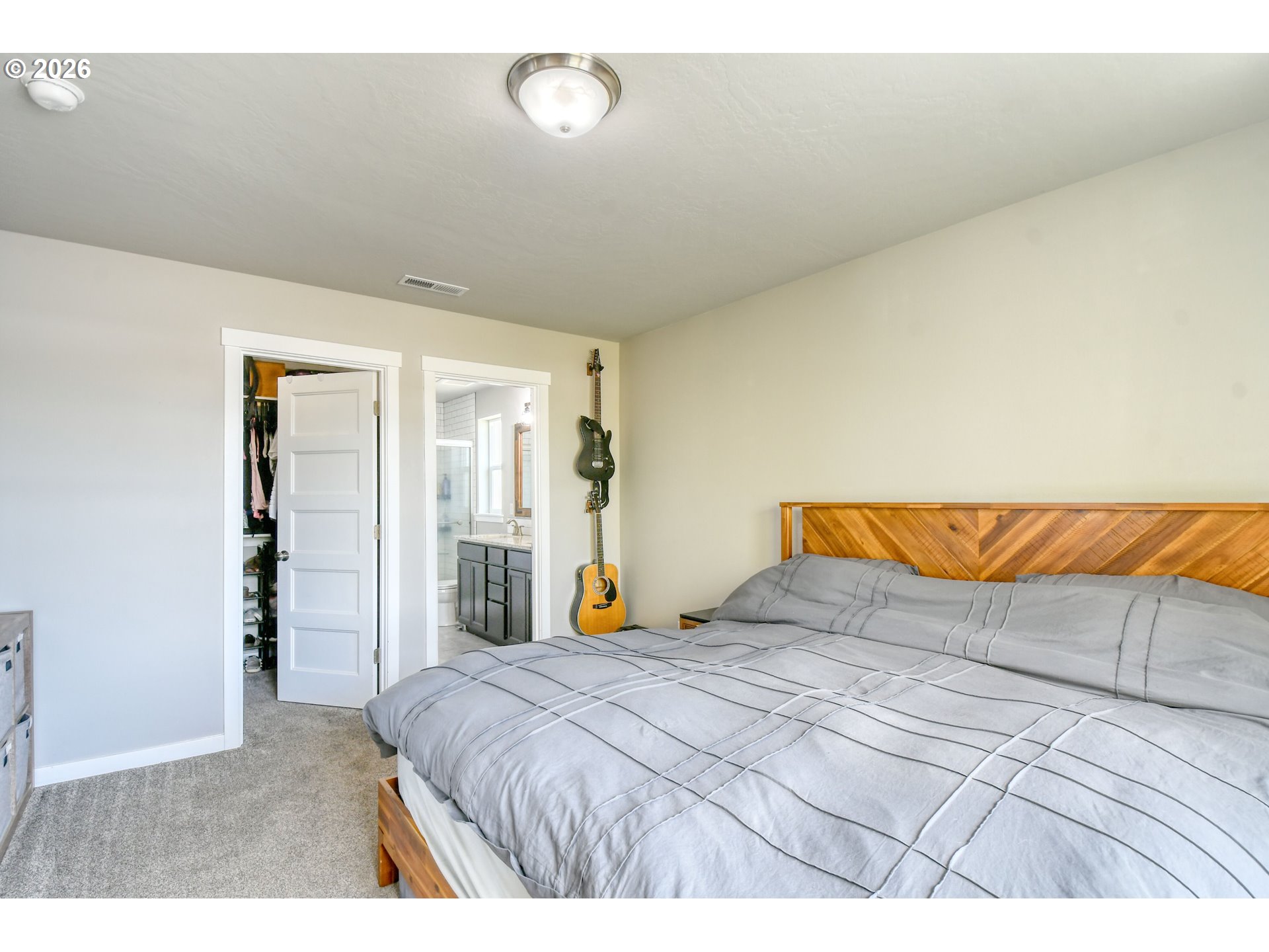233 East Jefferson Street Athena, OR 97813 - Photo 16 of 36 a bedroom with a large bed and a large closet