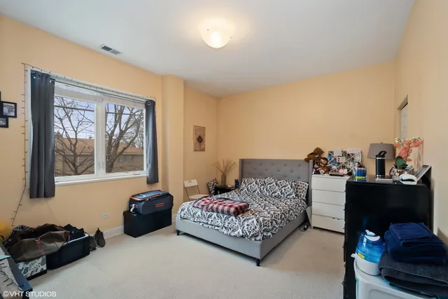 a bedroom with a bed furniture and a window