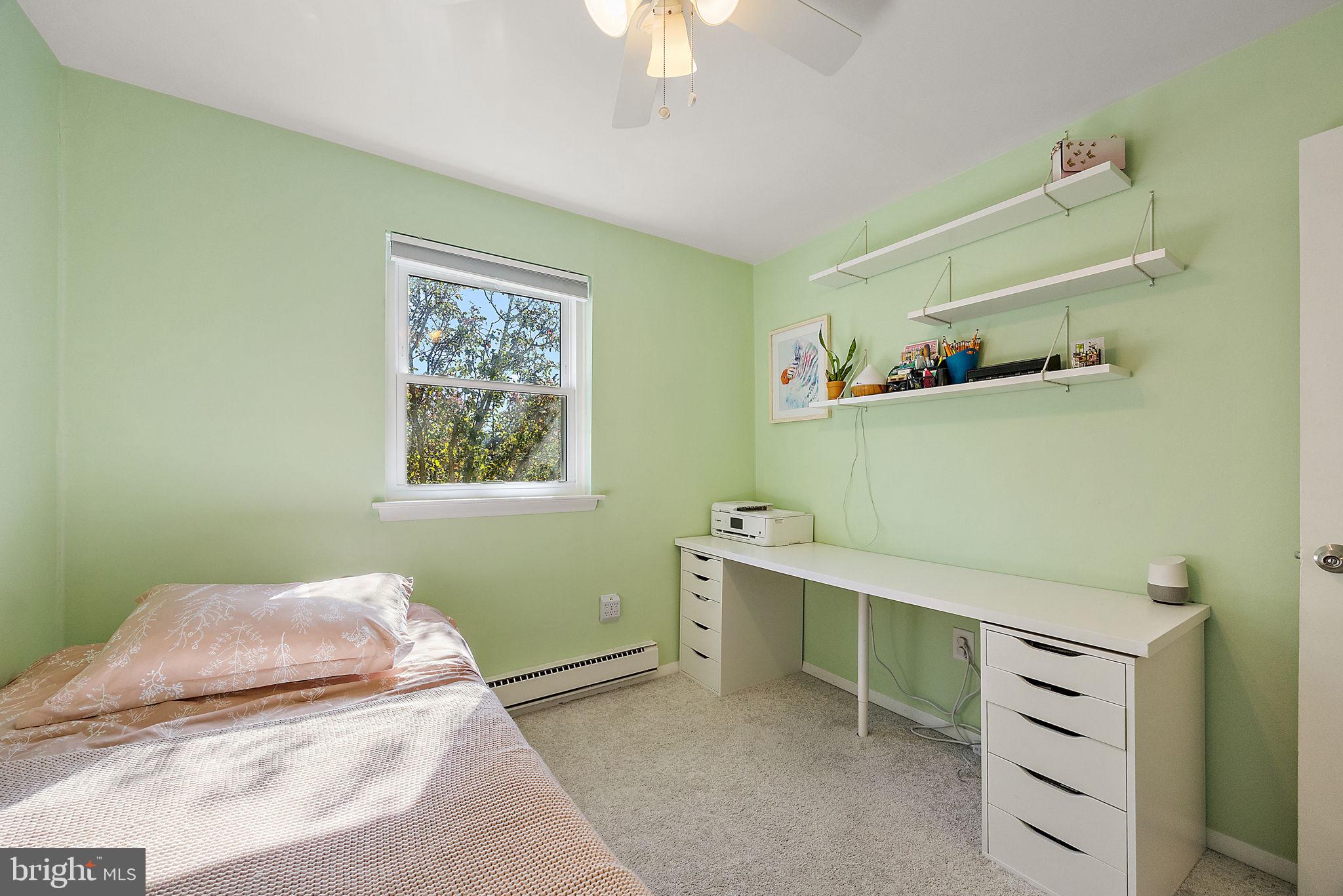117 Railroad Avenue, Unit A7 West Grove, PA 19390 - Photo 19 of 27 a bedroom with a bed and a window