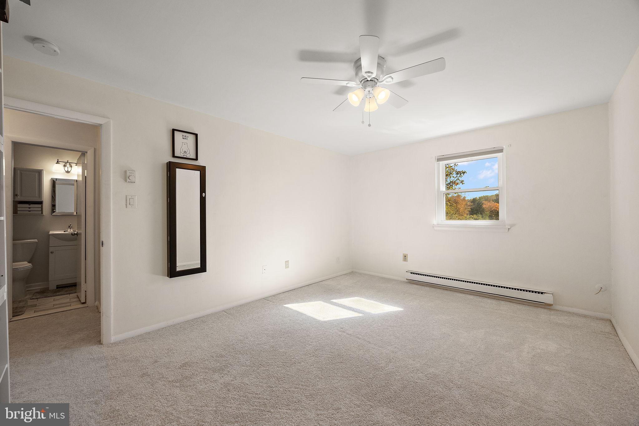 117 Railroad Avenue, Unit A7 West Grove, PA 19390 - Photo 22 of 27 a view of an empty room with a window