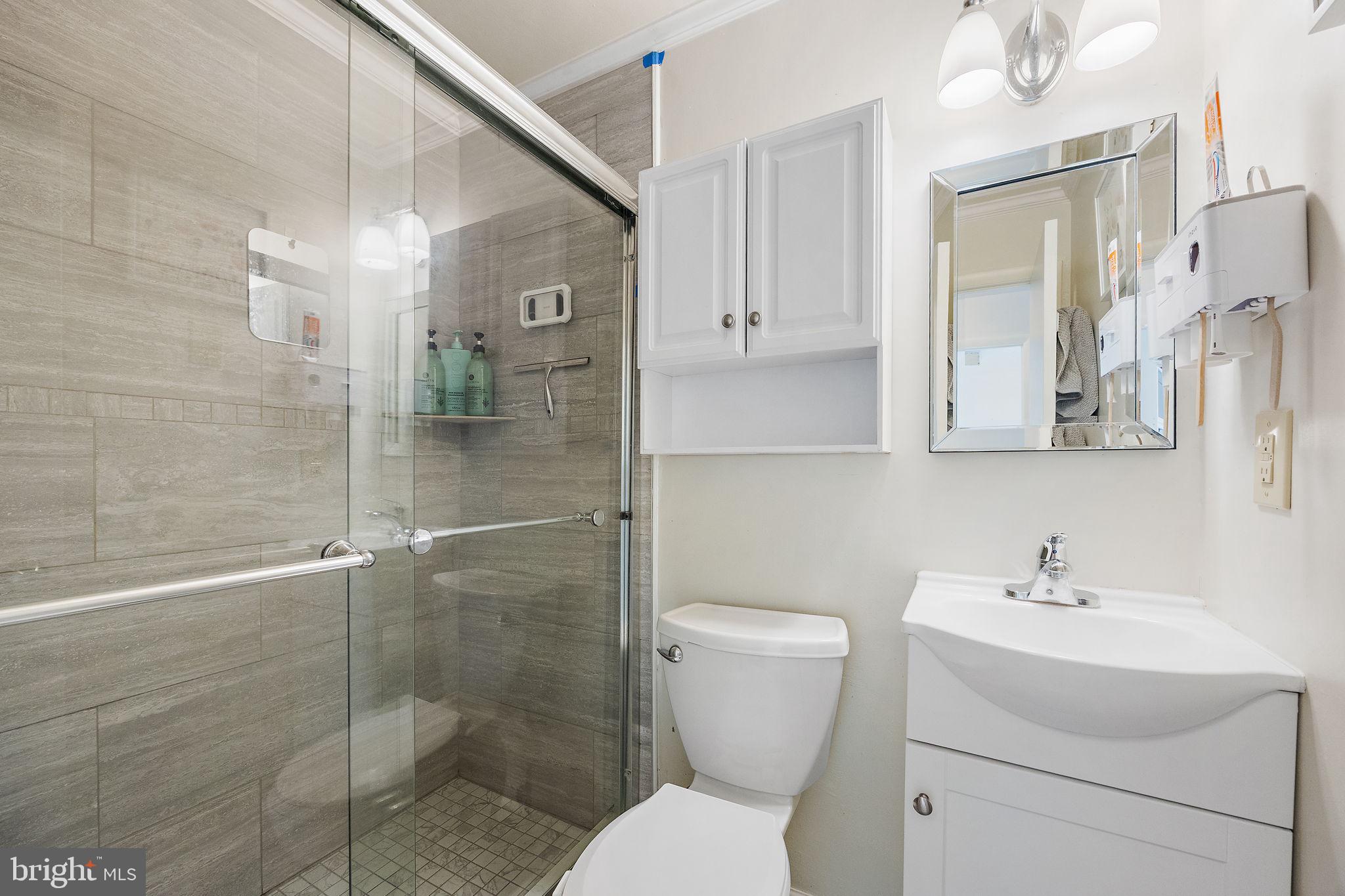 117 Railroad Avenue, Unit A7 West Grove, PA 19390 - Photo 23 of 27 a bathroom with a toilet sink and shower