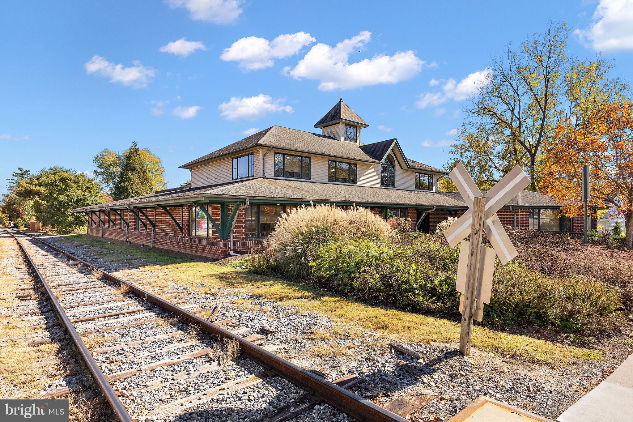 117 Railroad Avenue, Unit A7 West Grove, PA 19390 - Photo 24 of 27 a front view of a house with garden