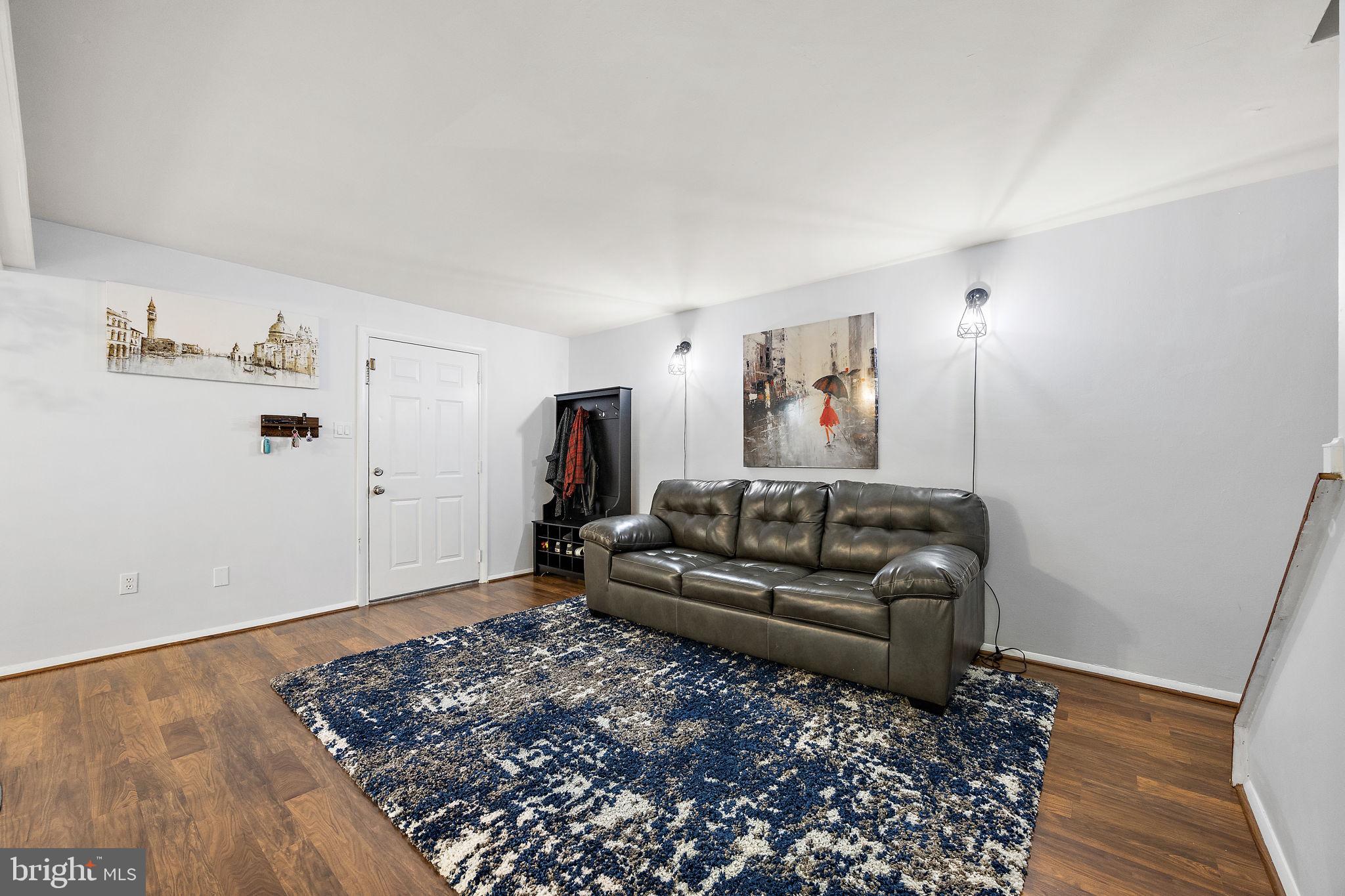 117 Railroad Avenue, Unit A7 West Grove, PA 19390 - Photo 6 of 27 a living room with furniture and wooden floor
