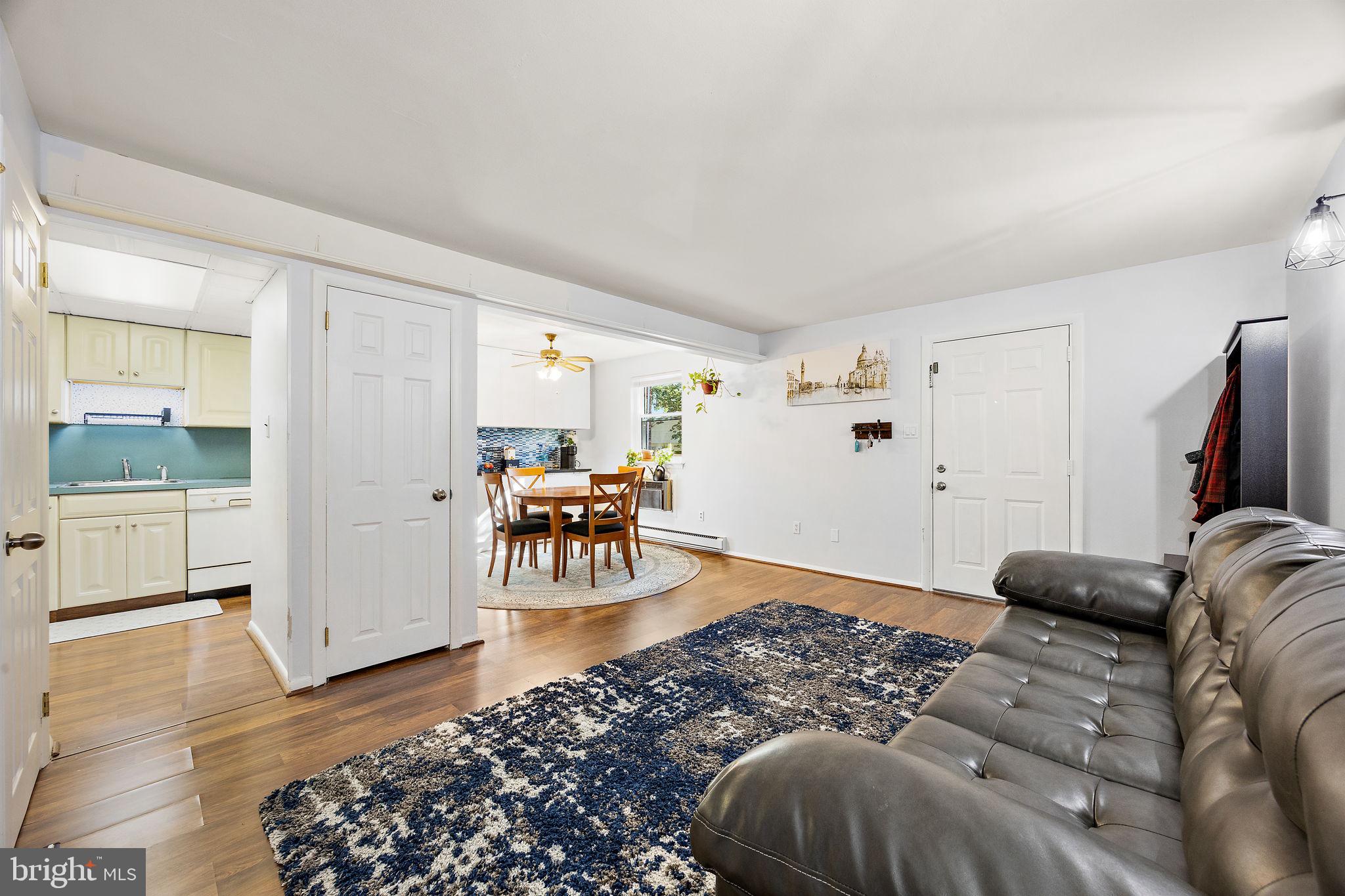 117 Railroad Avenue, Unit A7 West Grove, PA 19390 - Photo 7 of 27 a living room with furniture and a table