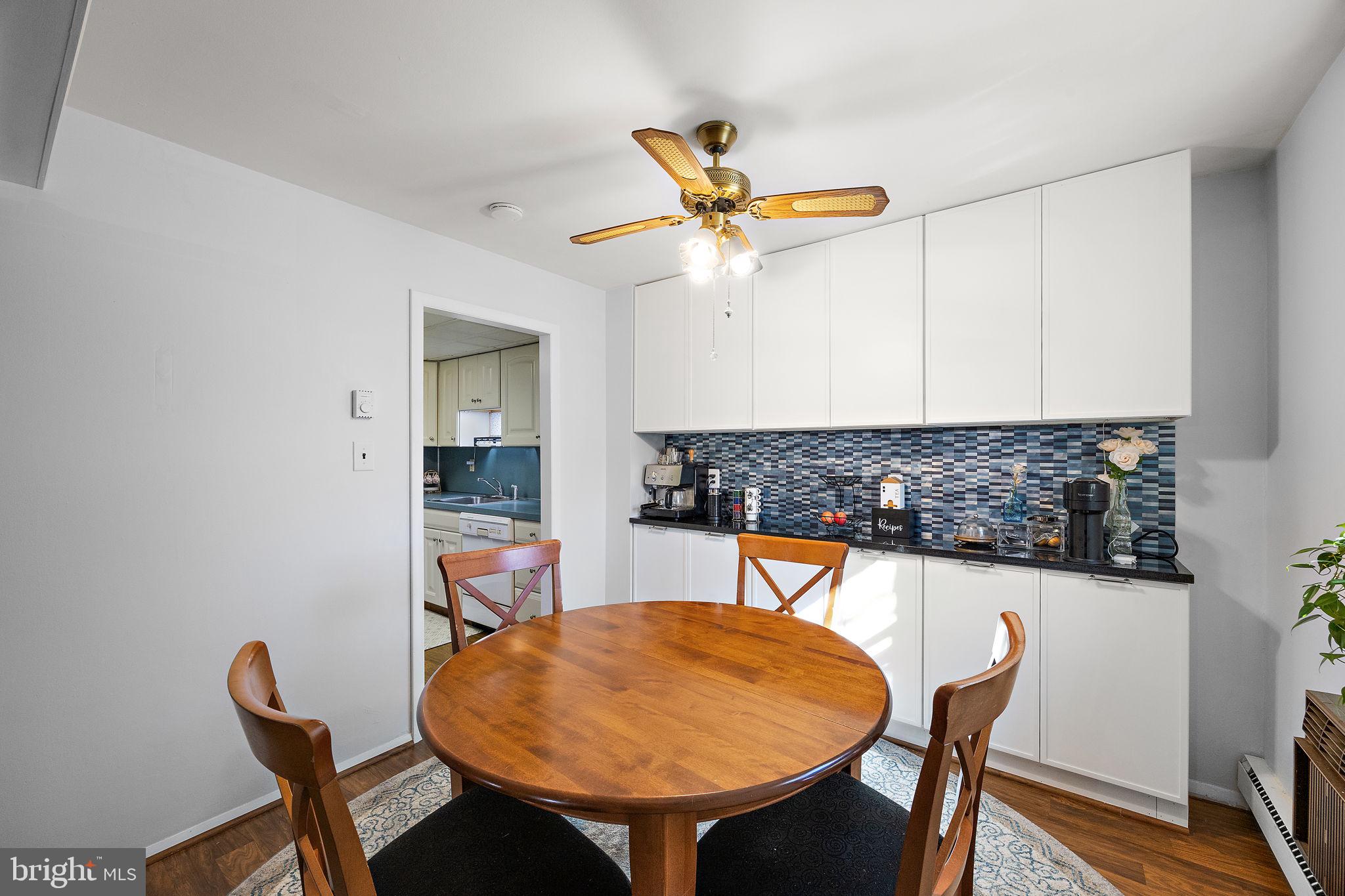117 Railroad Avenue, Unit A7 West Grove, PA 19390 - Photo 8 of 27 a view of a dining room with furniture and a chandelier