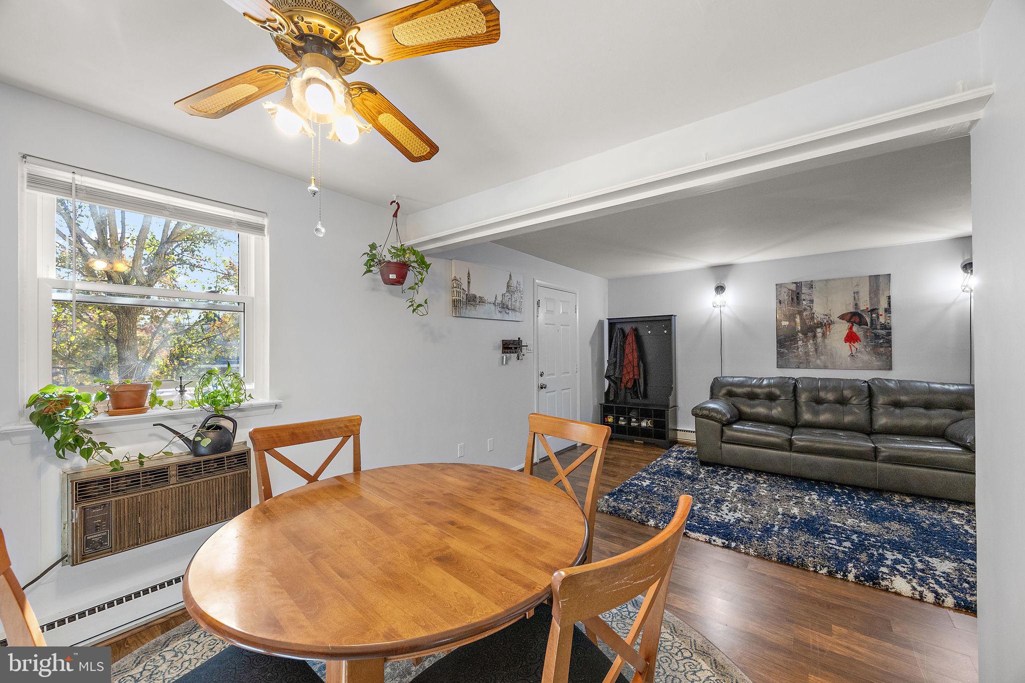 117 Railroad Avenue, Unit A7 West Grove, PA 19390 - Photo 9 of 27 a living room with furniture and a window