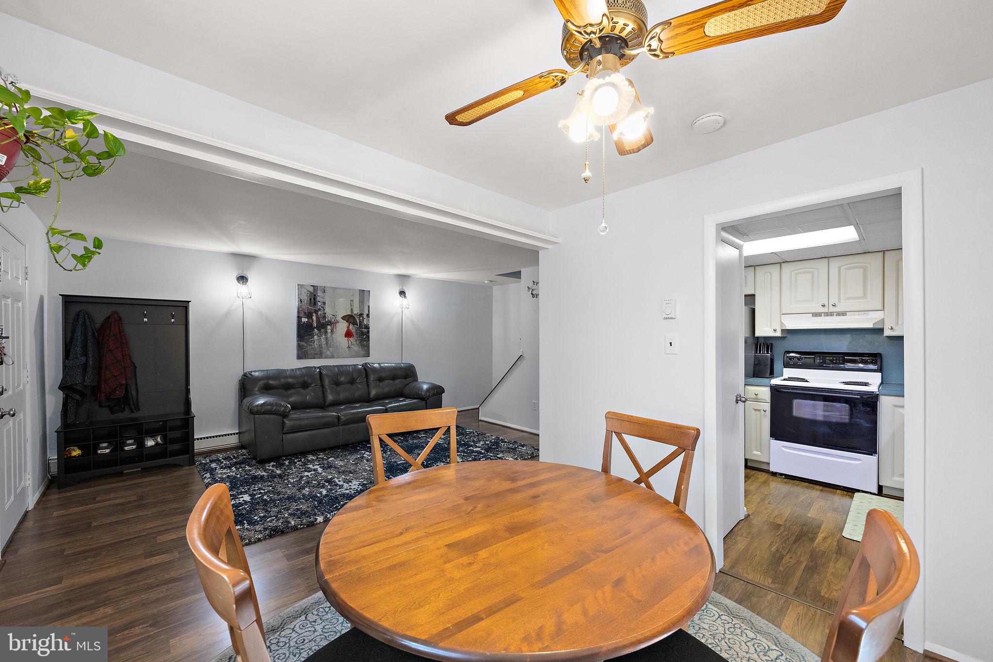 117 Railroad Avenue, Unit A7 West Grove, PA 19390 - Photo 10 of 27 a living room with furniture and a dining table