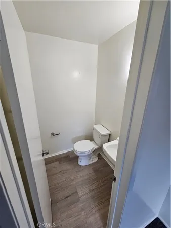 a bathroom with a sink a toilet a mirror and vanity