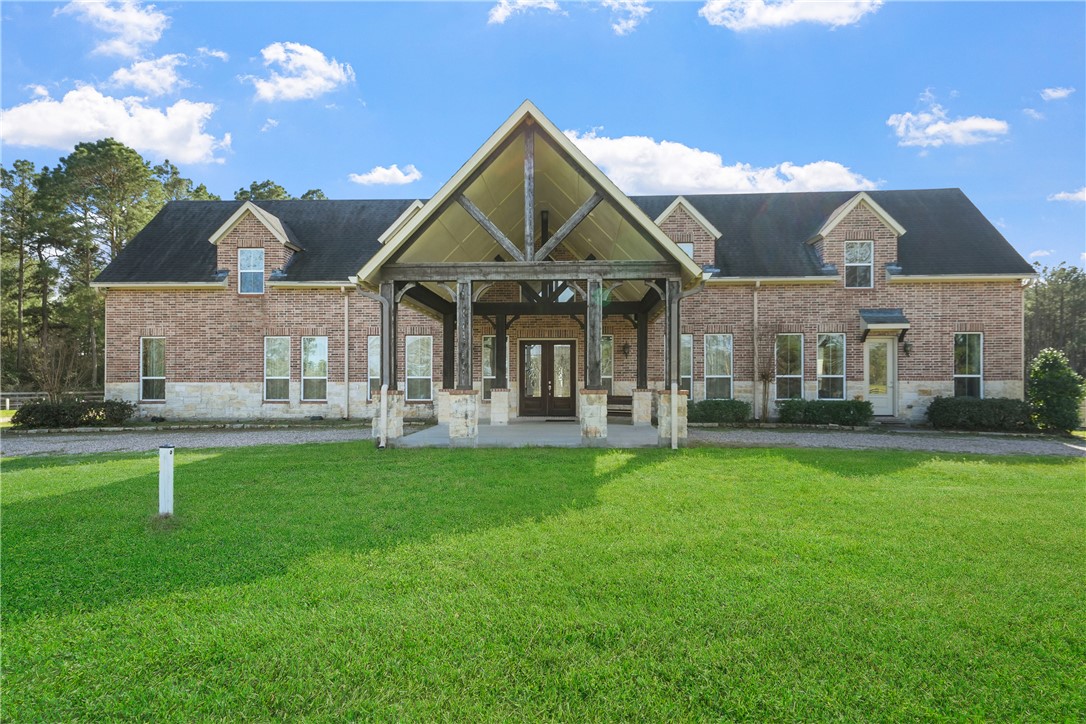 26250 Riley Road Waller, TX 77484 - Photo 3 of 14 a front view of a house with a yard