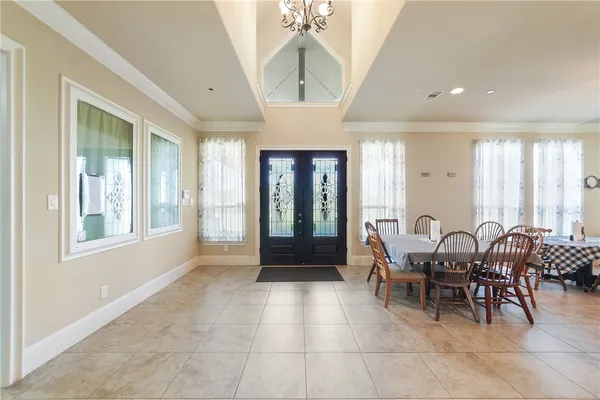 a dining room with furniture and window