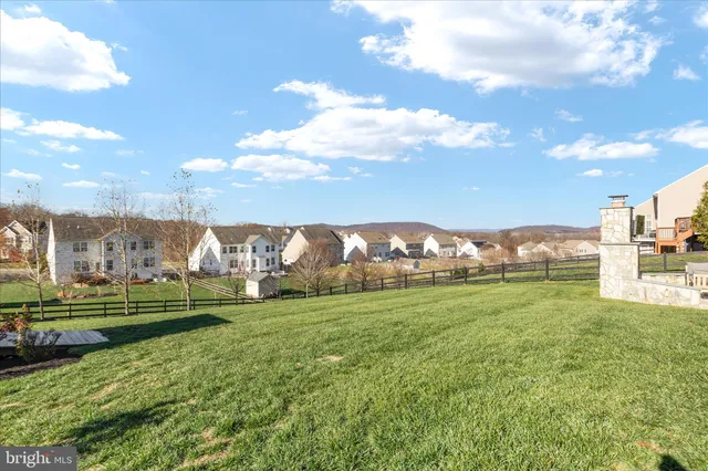 a view of a grassy field with trees
