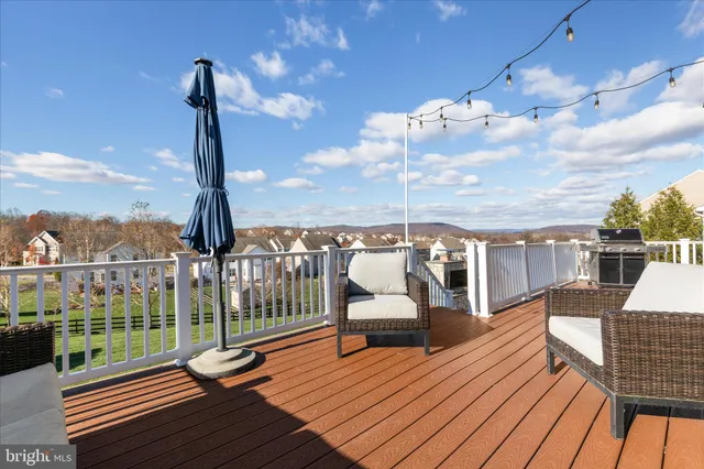 a view of a balcony with wooden floor