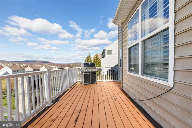 a view of a balcony with wooden floor