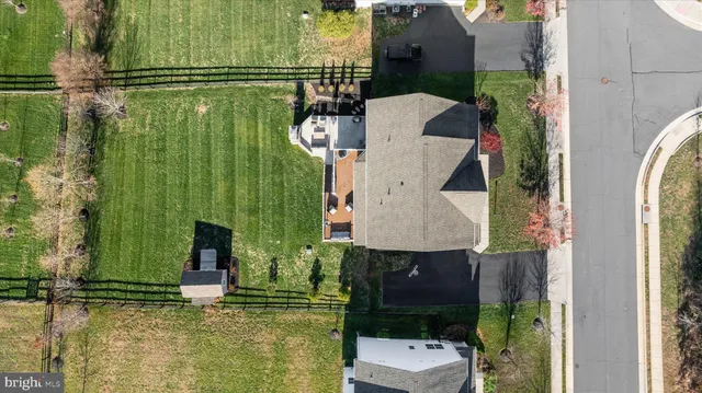 an aerial view of a house with a swimming pool
