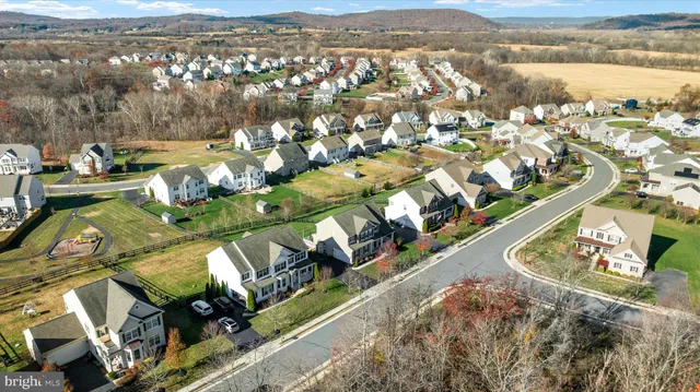 an aerial view of a house with a ocean view