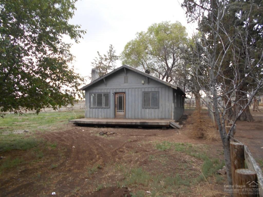 23045 Alfalfa Market Road Bend, OR 97701 - Photo 1 of 12 a house with trees in the background