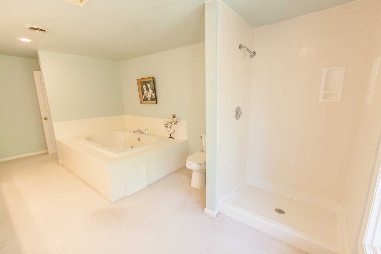 235 Mish Barn Road Staunton, VA 24401 - Photo 24 of 50 a white bath tub sitting next to a white toilet