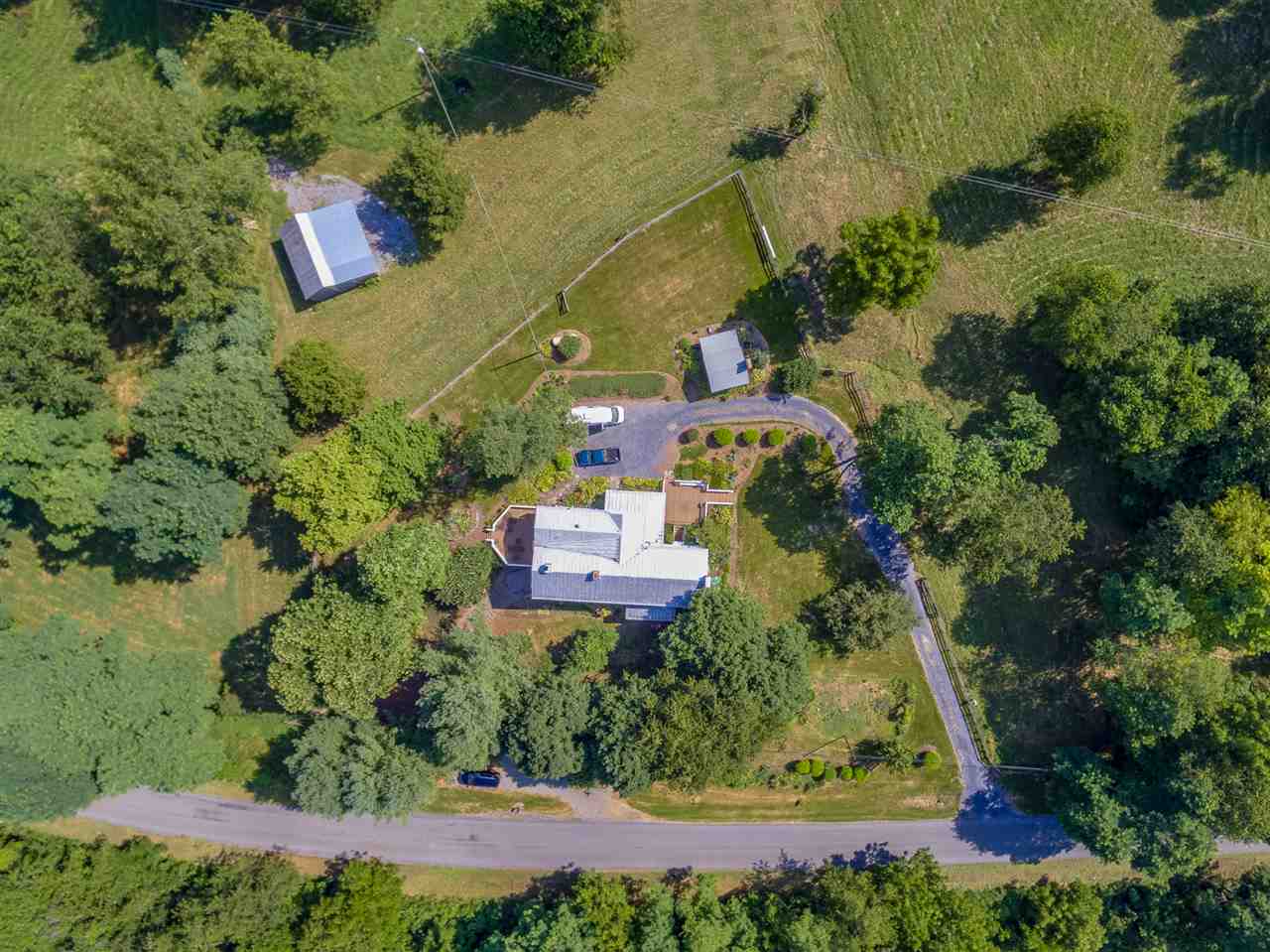 235 Mish Barn Road Staunton, VA 24401 - Photo 44 of 50 an aerial view of a house with a yard and lake view