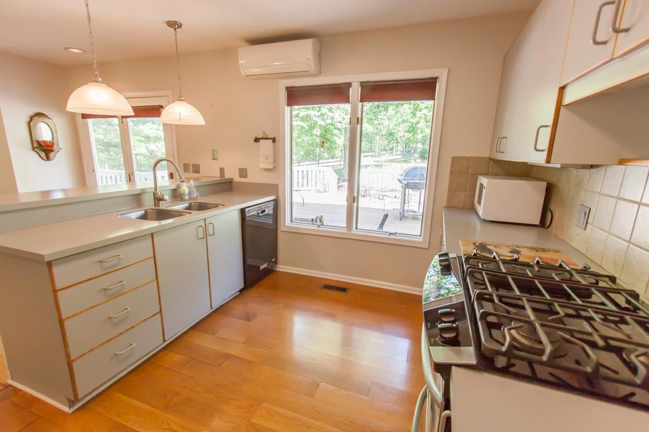 235 Mish Barn Road Staunton, VA 24401 - Photo 8 of 50 a kitchen with a sink appliances and cabinets