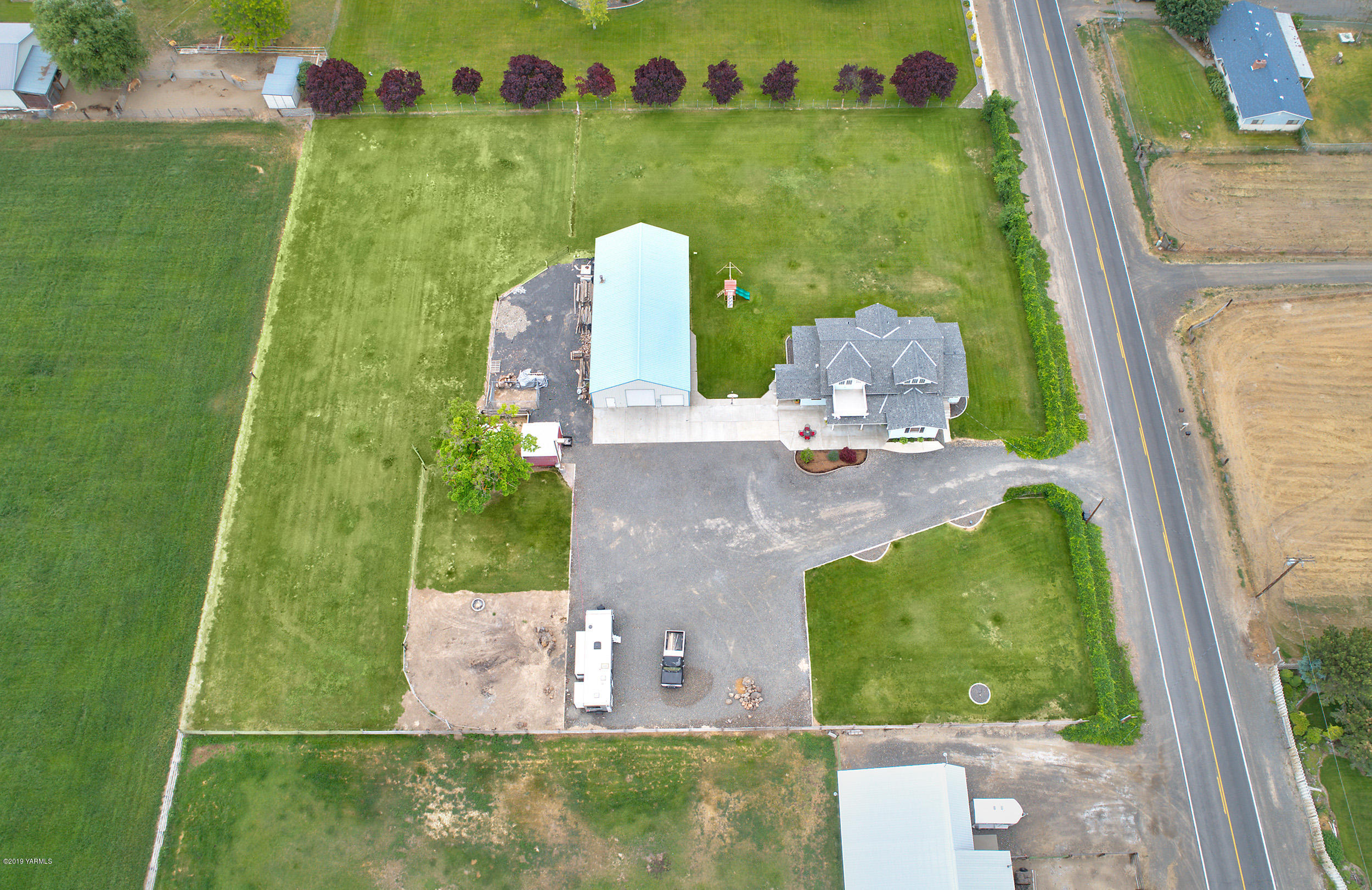 3551 Birchfield Road Moxee, WA 98936 - Photo 8 of 24 an aerial view of a house having yard