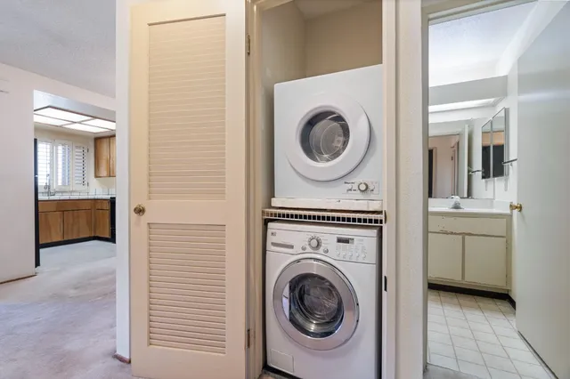 a view of a hallway with washer and dryer
