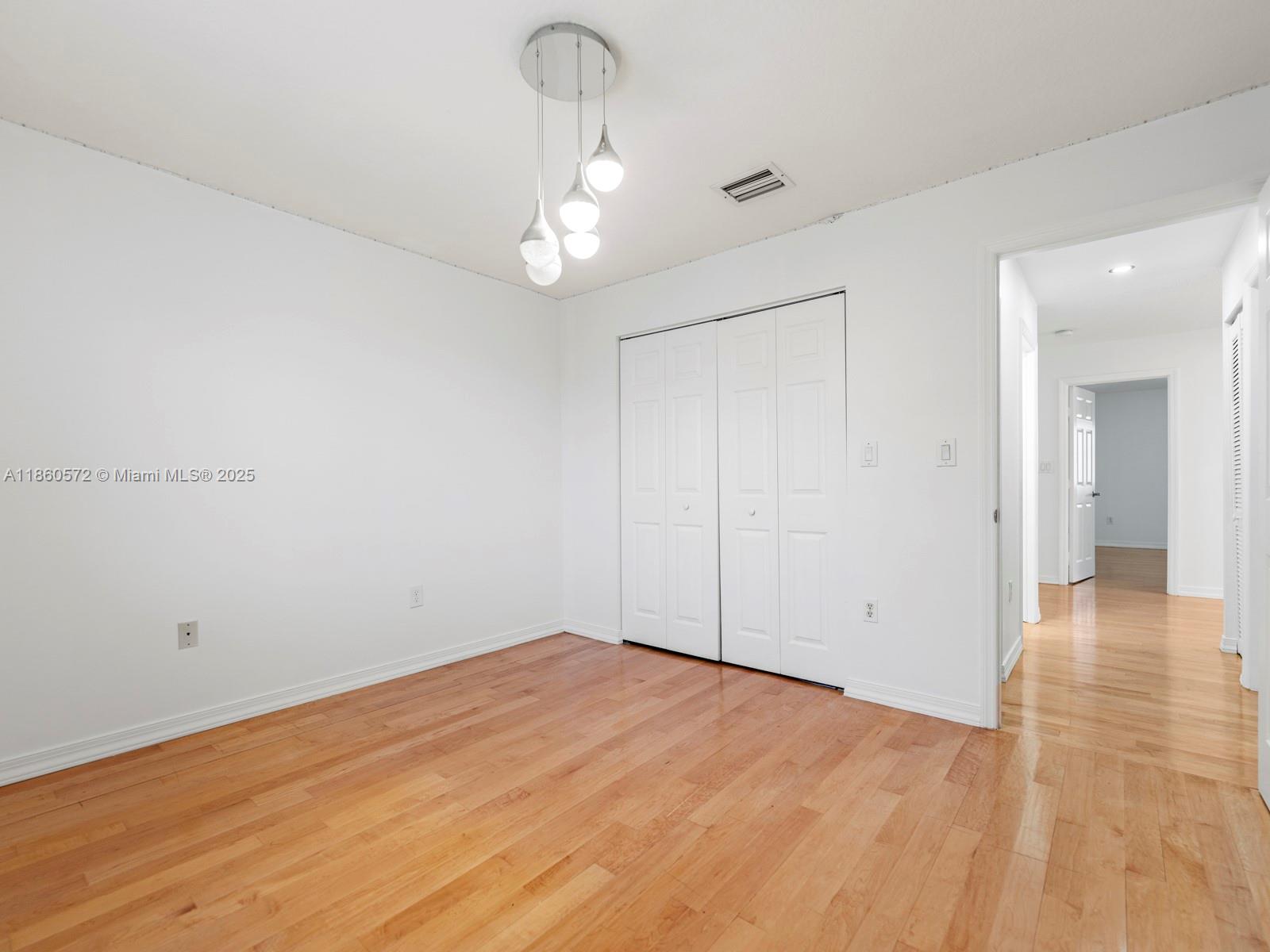 16544 Southwest 68th Terrace Miami, FL 33193 - Photo 20 of 32 a view of empty room with wooden floor