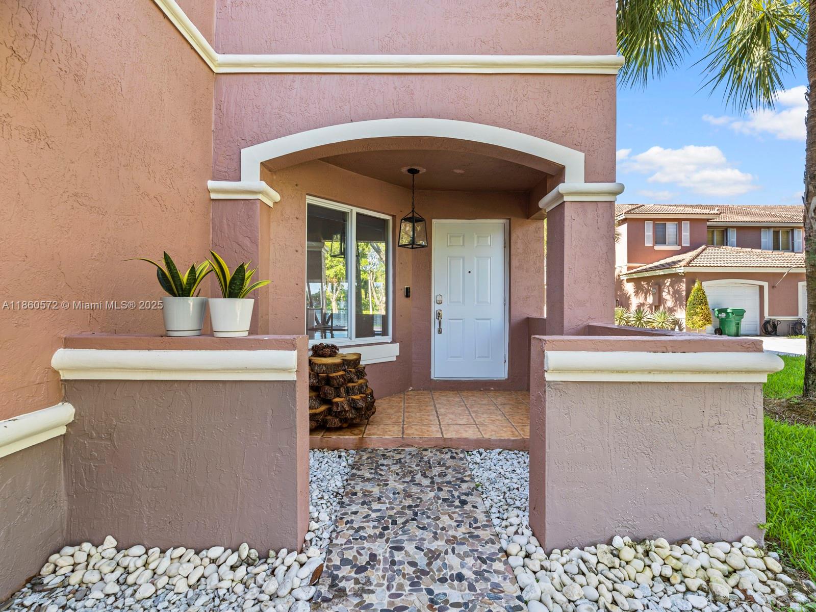 16544 Southwest 68th Terrace Miami, FL 33193 - Photo 21 of 32 a view of a living room and entryway