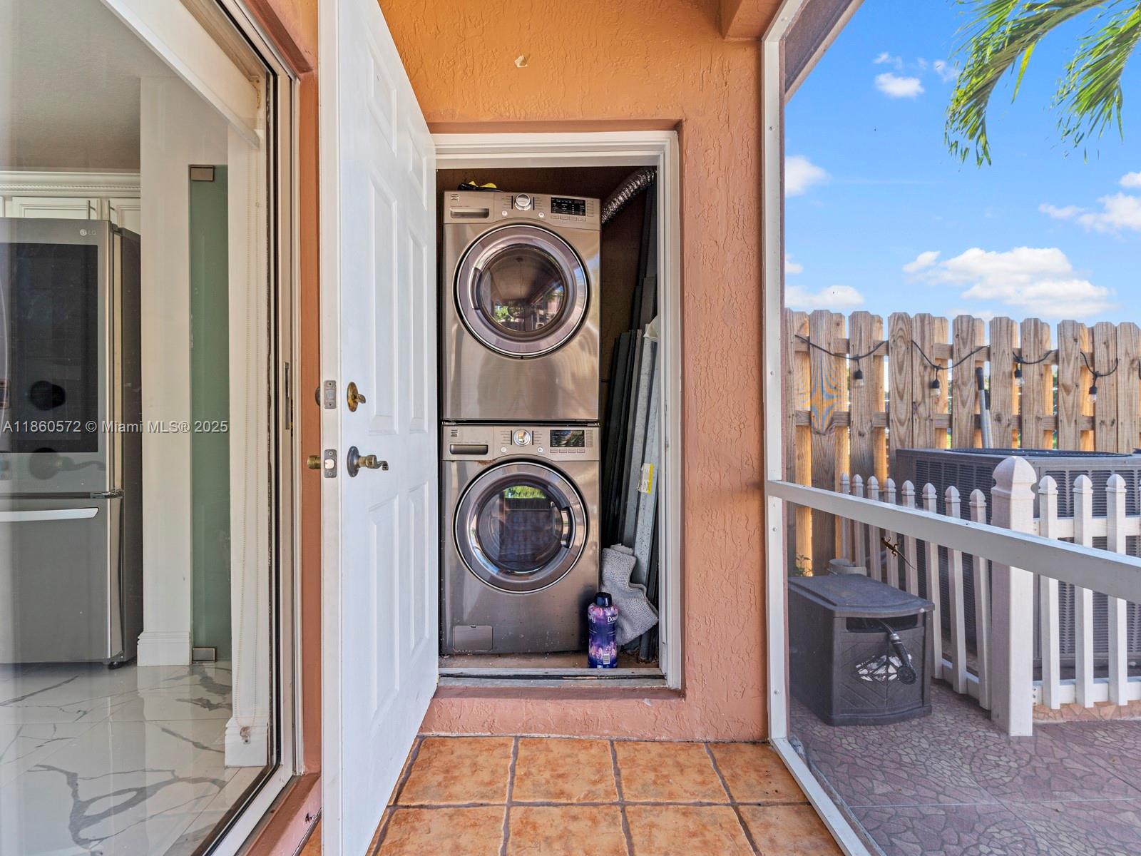 16544 Southwest 68th Terrace Miami, FL 33193 - Photo 25 of 32 a view of a hallway with washer and dryer