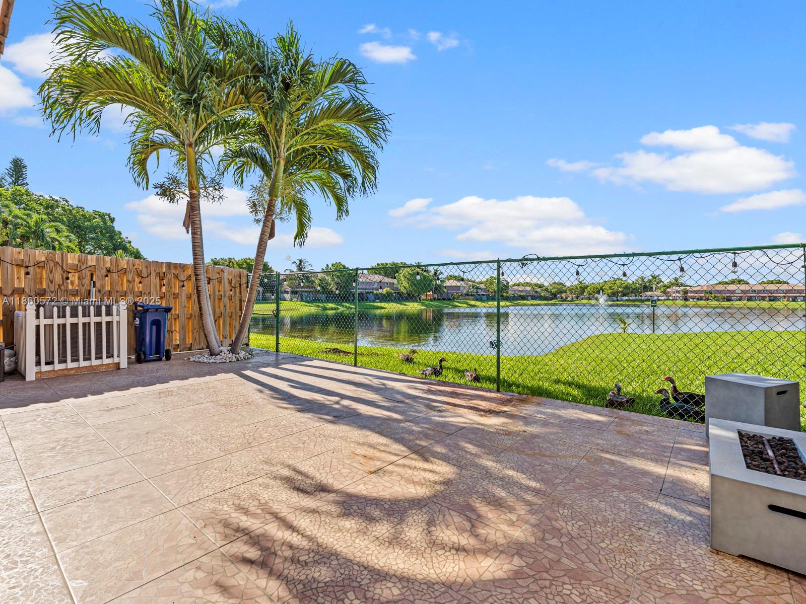 16544 Southwest 68th Terrace Miami, FL 33193 - Photo 28 of 32 a view of a lake with a yard