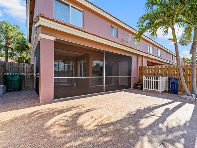 a view of a room with wooden floor and a bathroom