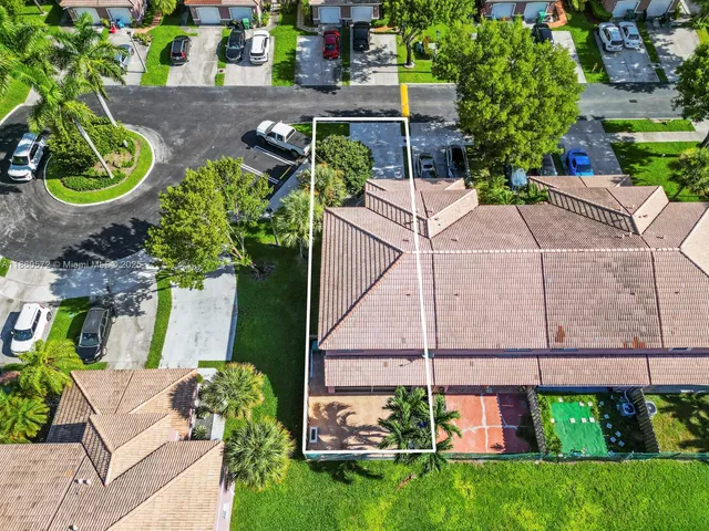 an aerial view of residential houses and city street