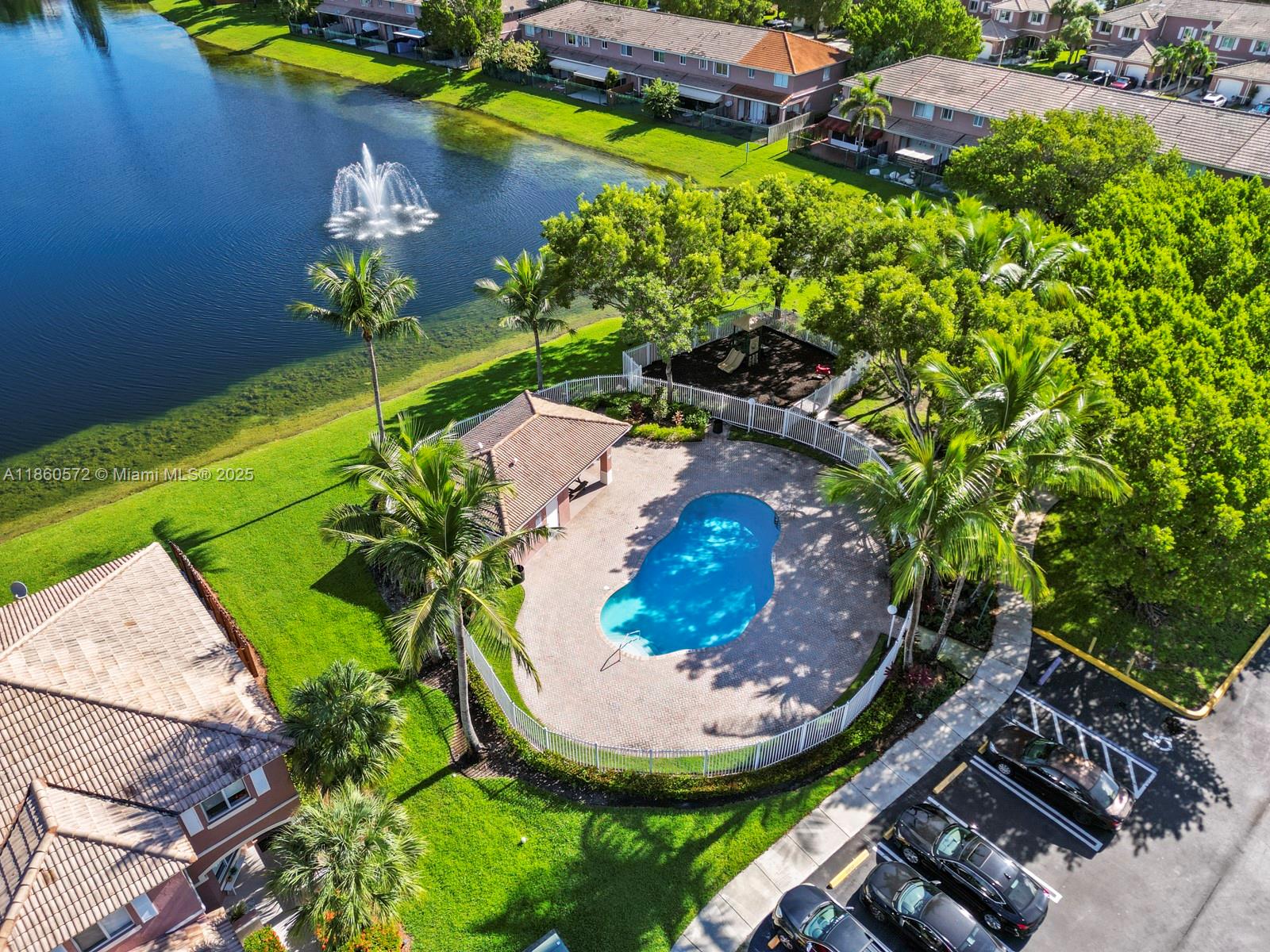 16544 Southwest 68th Terrace Miami, FL 33193 - Photo 6 of 32 an aerial view of a house with a swimming pool a yard and garden