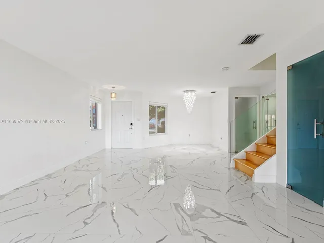 a view of an empty room and window