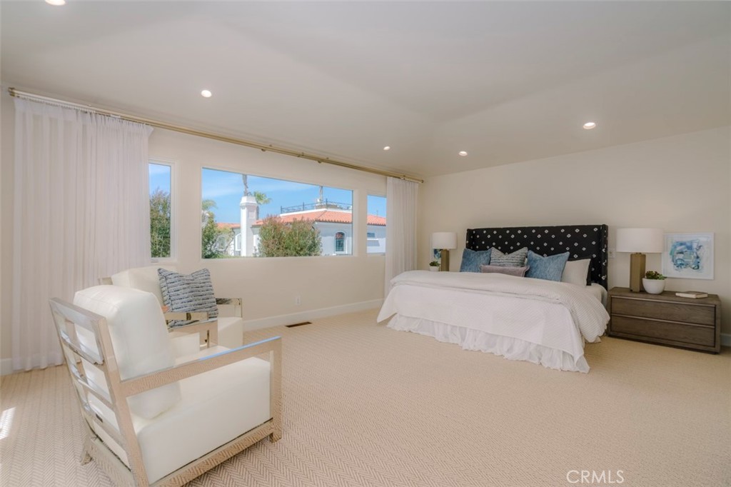 120 Via Trieste Newport Beach, CA 92663 - Photo 23 of 39 a bedroom with a large bed and a window