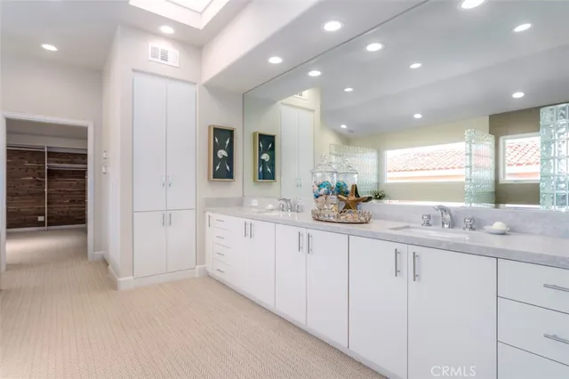 a bathroom with sink and mirror