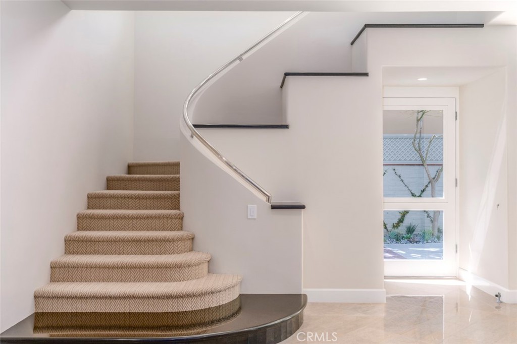 120 Via Trieste Newport Beach, CA 92663 - Photo 7 of 39 a view of entryway and hall with wooden floor
