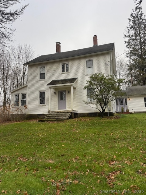 78 Hennequin Road Columbia, CT 06237 - Photo 1 of 27 a front view of a house with garden