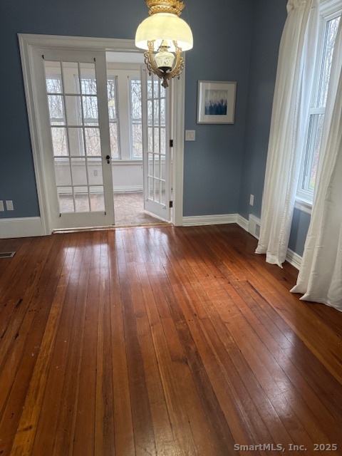 78 Hennequin Road Columbia, CT 06237 - Photo 12 of 27 wooden floor in an empty room with a window