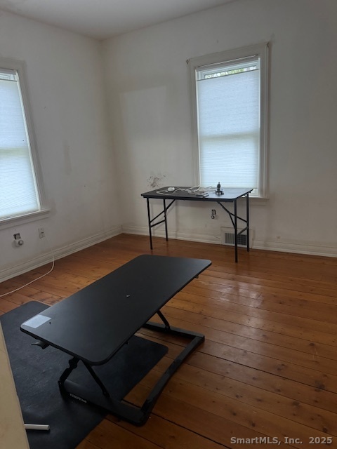 78 Hennequin Road Columbia, CT 06237 - Photo 19 of 27 a living room with pool table chair and a wooden floor