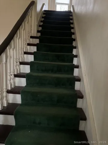 a living room with a furniture and a window