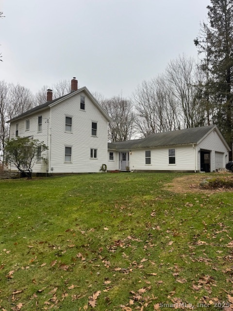 78 Hennequin Road Columbia, CT 06237 - Photo 2 of 27 a front view of a house with a garden