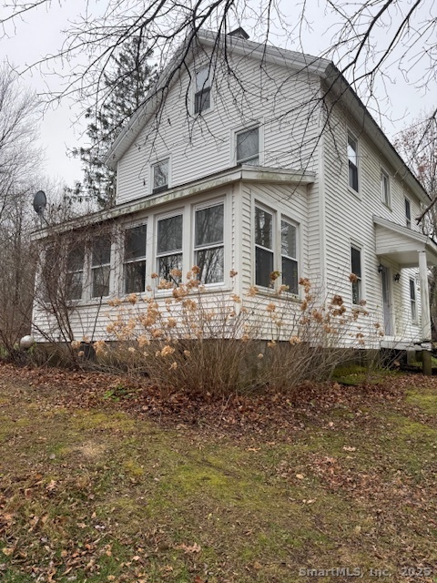 78 Hennequin Road Columbia, CT 06237 - Photo 3 of 27 a front view of a house with a yard