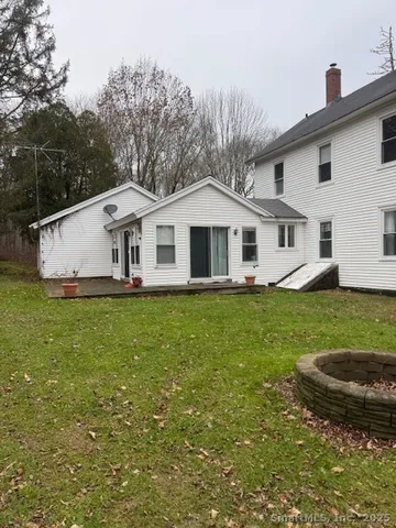 a front view of a house with a garden and yard