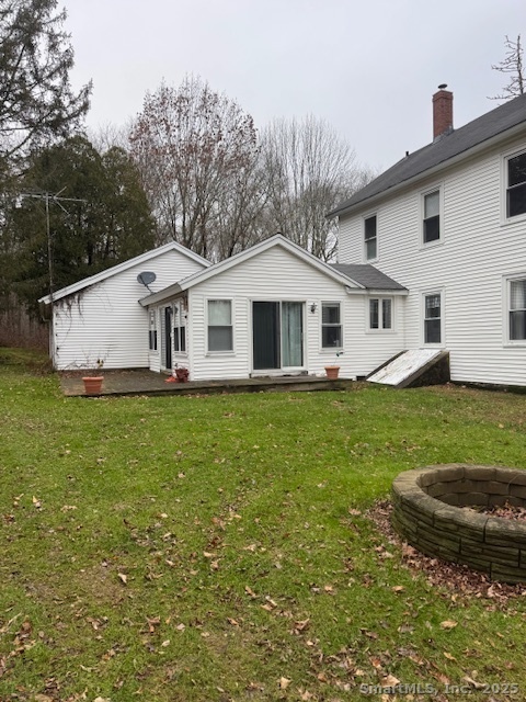 78 Hennequin Road Columbia, CT 06237 - Photo 4 of 27 a front view of a house with a garden and yard
