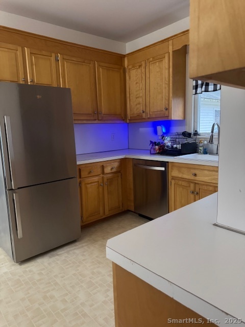 78 Hennequin Road Columbia, CT 06237 - Photo 8 of 27 a kitchen with stainless steel appliances a refrigerator sink and cabinets