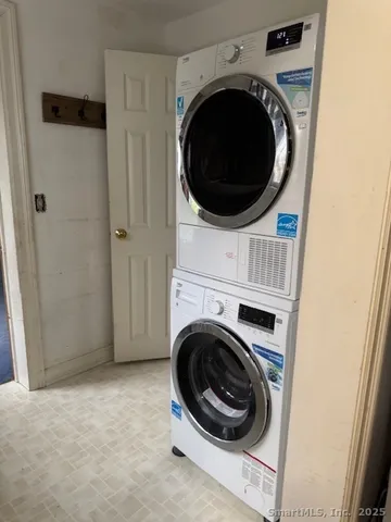 a view of a hallway with washer and dryer