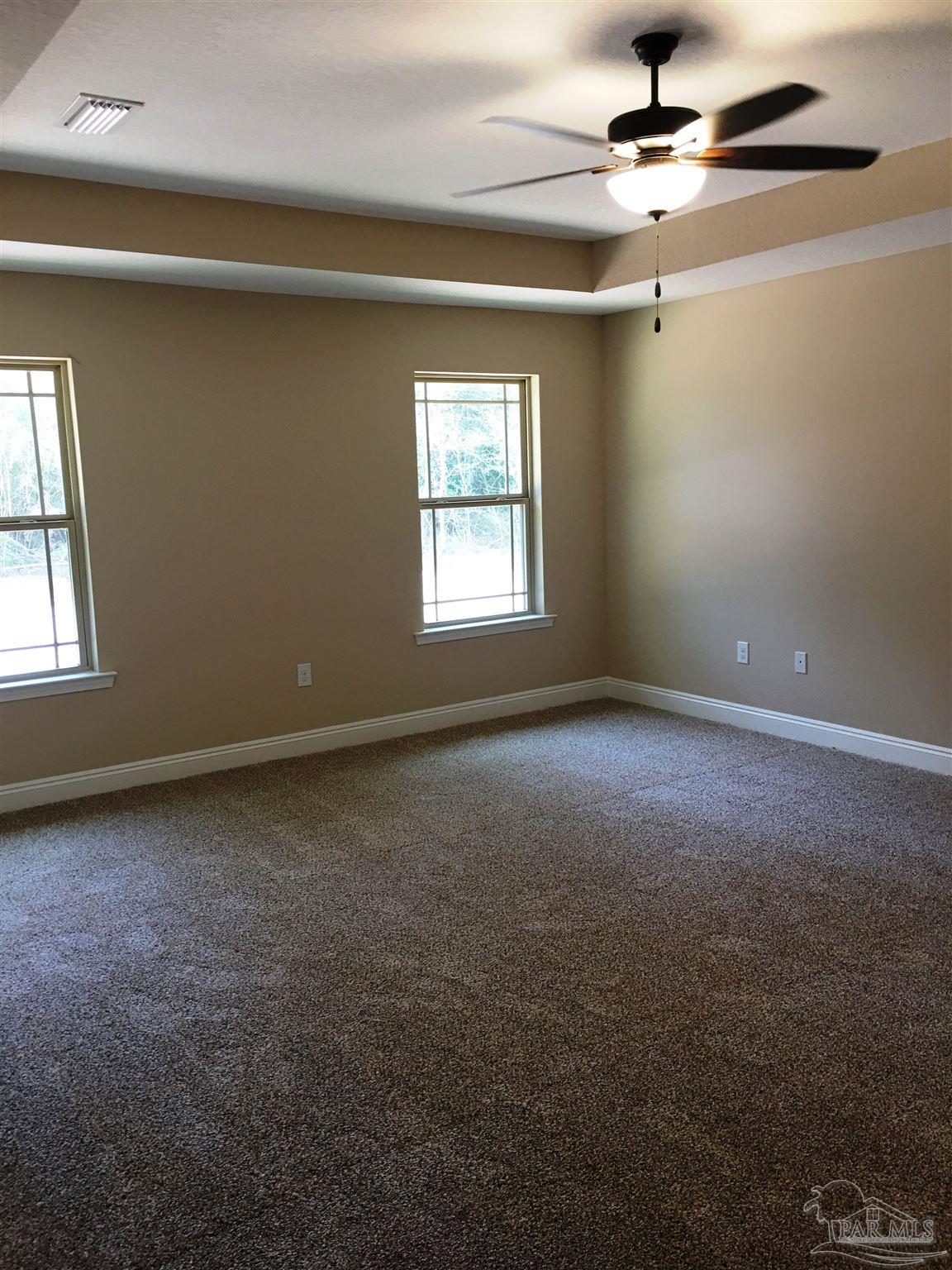 5406 South A Jones Road Milton, FL 32583 - Photo 25 of 35 Master bedroom has a box ceiling w/fan/light.