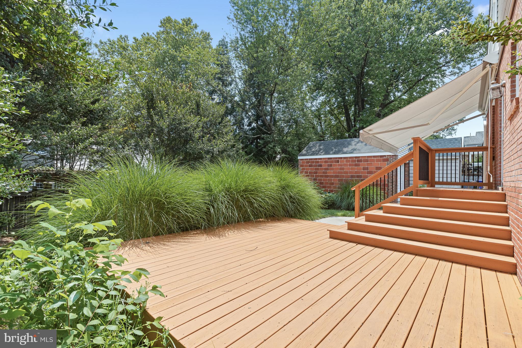 504 Pershing Drive Silver Spring, MD 20910 - Photo 8 of 45 Expansive deck and patio with retractable awning