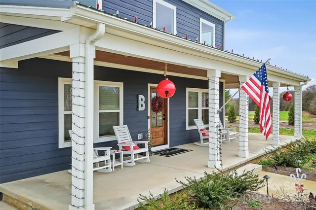 front view of house with outdoor seating