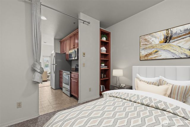 a bedroom with a bed and a walk in closet